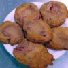 Freshly made strawberry cookies resting on a white plate